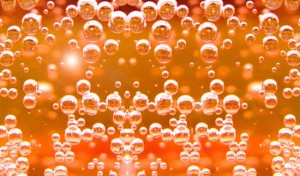Fizzy Kombucha Bubbles Beautiful carbonation bubbles rise through amber liquid.