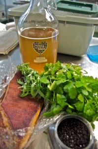 Rose Black House Kombucha used to flavor bacon Rose Black House Kombucha used to flavor bacon with bunches of cilantro at the first Propser Dinner at the House Kombucha Brewery