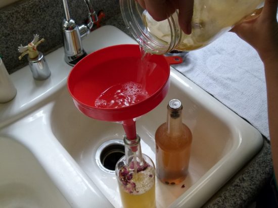 Pour Kombucha Through a Funnel to Bottle