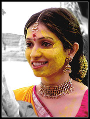 indian woman with turmeric on her face